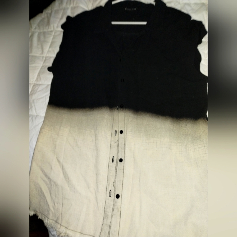 Sleeveless black and tan button up shirt